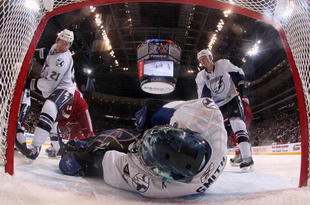GLENDALE, AZ - NOVEMBER 16: Goaltender Mike Smith #41 of the Tampa Bay Lightning covers the puck as David Hale #21 and Matt Walker #8 skate in during the NHL game against the Phoenix Coyotes at Jobing.com Arena on November 16, 2009 in Glendale, Arizona. The Lightning defeated the Coyotes 4-1. (Photo by Christian Petersen/Getty Images)