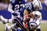 INDIANAPOLIS - NOVEMBER 15:  Melvin Bullitt #33 of the Indianapolis Colts tackles Kevin Faulk #33 of the New England Patriots short of a first down to gain possesion late in the fourth quarter of the game at Lucas Oil Stadium on November 15, 2009 in Indianapolis, Indiana. The Colts won the 35-34. (Photo by Jamie Squire/Getty Images)