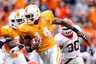 KNOXVILLE, TN - OCTOBER 10: Eric Berry #14 of the Tennessee Volunteers runs with the ball after intercepting a pass during the SEC game against the Georgia Bulldogs at Neyland Stadium on October 10, 2009 in Knoxville, Tennessee. (Photo by Andy Lyons/Getty Images)
