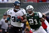 EAST RUTHERFORD, NJ - NOVEMBER 15:  Maurice Jones-Drew #32 of the Jacksonville Jaguars runs the ball past Dwight Lowery #21 of the New York Jets for a first quarter touchdown on November 15, 2009 at Giants Stadium in East Rutherford, New Jersey.  (Photo by Jim McIsaac/Getty Images)
