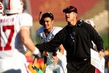 LOS ANGELES, CA - NOVEMBER 14:  Head coach Jim Harbaugh of the Stanford Cardinal greets his offense after a touchdown during the game with the USC Trojans on November 14, 2009 at the Los Angeles Coliseum in Los Angeles, California.  Stanford won 55-21.  (Photo by Stephen Dunn/Getty Images)