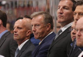 TORONTO - SEPTEMBER 22:  Head Coach Ron Wilson (C) of the Toronto Maple Leafs looks on along with assistant coaches Keith Acton (L), Rob Zettler (far left) and Tim Hunter (R) against the Buffalo Sabres during their pre season NHL game at the Air Canada Centre on September 26, 2008 in Toronto, Ontario, Canada. (Photo By Dave Sandford/Getty Images)