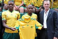 JOHANNESBURG, SOUTH AFRICA - NOVEMBER 11: Bafana Captain Aaron Mokeona, Tshepo Masilela and Adidas SA MD Brian Kerby present the new Bafana Bafana FIFA World Cup 2010 jersey at the Market Theatre on November 11, 2009 in Johannesburg, South Africa. (Photo by Lefty Shivambu/Gallo Images/Getty Images)