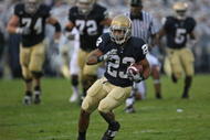 SOUTH BEND, IN - OCTOBER 03: Golden Tate #23 of the Notre Dame Fighting Irish runs against the Washington Huskies on his way to a 67 yard touchdown on October 3, 2009 at Notre Dame Stadium in South Bend, Indiana. (Photo by Jonathan Daniel/Getty Images)