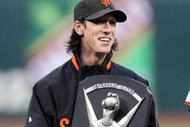 SAN FRANCISCO - APRIL 08:  Pitcher Tim Lincecum #55 of the San Francisco Giants celebrates after receiving his 2008 Cy Young award before his game against the Milwaukee Brewers at a Major League Baseball game on April 8, 2009 at AT&T Park in San Francisco, California.  (Photo by Jed Jacobsohn/Getty Images)