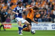 HULL, ENGLAND - SEPTEMBER 19:  Stephen Hunt of Hull City (R) in action with Barry Ferguson of Birmingham City during the Barclays Premier League match between Hull City and Birmingham City at the KC Stadium on September 19, 2009 in Hull, England.  (Photo by Clive Brunskill/Getty Images)