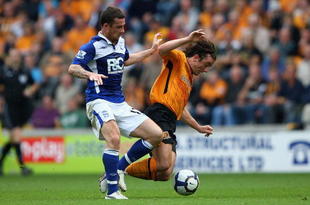 HULL, ENGLAND - SEPTEMBER 19:  Stephen Hunt of Hull City (R) in action with Barry Ferguson of Birmingham City during the Barclays Premier League match between Hull City and Birmingham City at the KC Stadium on September 19, 2009 in Hull, England.  (Photo by Clive Brunskill/Getty Images)