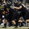 EUGENE,OR - NOVEMBER 14: Linebacker Eddie Pleasant #11, linebacker Casey Matthews #55 and defensive tackle Brandon Bair #88 of the Oregon Ducks gang up to tackle running back Dimitri Nance #31of the Arizona State Sun Devils in the first quarter of the game at Autzen Stadium on November 14, 2009 in Eugene, Oregon. (Photo by Steve Dykes/Getty Images)