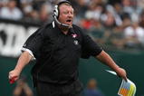 OAKLAND, CA - OCTOBER 18:  Head coach Tom Cable of the Oakland Raiders looks on against the Philadelphia Eagles during an NFL game at the Oakland-Alameda County Coliseum on October 18, 2009 in Oakland, California.  (Photo by Jed Jacobsohn/Getty Images)