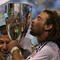 BRIDGEVIEW, IL - NOVEMBER 14: Kyle Beckerman #5 of Real Salt Lake kisses the trophy as goalkeeper Nick Rimando #18 celebrates after a win over the Chicago Fire during the MLS Eastern Conference Championship at Toyota Park on November 14, 2009 in Bridgeview, Illinois. Real Salt Lake defeated the Fire 0-0 (5-4) in a shoot-out. (Photo by Jonathan Daniel/Getty Images)