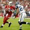 GLENDALE, AZ - NOVEMBER 15: Quarterback Kurt Warner #13 of the Arizona Cardinals drops back to pass while being defended by Deon Grant #24 of the Seattle Seahawks in the second half at University of Phoenix Stadium on November 15, 2009 in Glendale, Arizona. The Cardinals defeated the Seahawks 31-20. (Photo by Jeff Gross/Getty Images)