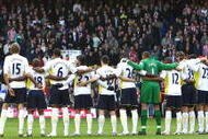 LONDON, ENGLAND - NOVEMBER 07:  The teams stand for a minutes silence ahead of the Barclays Premier League match between Tottenham Hotspur and Sunderland at White Hart Lane on November 7, 2009 in London, England.  (Photo by Ian Walton/Getty Images)