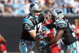 CHARLOTTE, NC - NOVEMBER 15:  Quarterback Jake Delhomme #17 of the Carolina Panthers hands off the ball to DeAngelo Williams #34 during the game against the Atlanta Falcons at Bank of America Stadium on November 15, 2009 in Charlotte, North Carolina.  (Photo by Streeter Lecka/Getty Images)