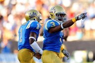 PASADENA, CA - SEPTEMBER 05:  Rahim Moore #3 and Alterraun Verner #1 of the UCLA Bruins celebrate a great play against San Diego State at the Rose Bowl on September 5, 2009 in Pasadena, California.  (Photo by Jacob de Golish/Getty Images)