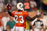 MIAMI - OCTOBER 12:  Running back Ronnie Brown #23 of the Miami Dolphins throws a pass against the New York Jets at Land Shark Stadium on October 12, 2009 in Miami, Florida. The Dolphins defeated the Jets 31-27.  (Photo by Doug Benc/Getty Images)