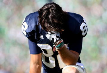 SOUTH BEND, IN - OCTOBER 17: Robby Parris #82 of the Notre Dame Fighting Irish takes a moment to himself before a game against the USC Trojans at Notre Dame Stadium on October 17, 2009 in South Bend, Indiana. USC defeated Notre Dame 34-27. (Photo by Jonathan Daniel/Getty Images)