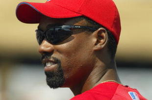 CLEARWATER, FL - MARCH 13:  Doug Glanville #6 of the Philadelphia Phillies looks on during the game against the Tampa Bay Devil Rays at Bright House Networks Field on March 13, 2004 in Clearwater, Florida.  The Devil Rays won 6-5.  (Photo by Harry How/Getty Images)