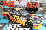 AVONDALE, AZ - NOVEMBER 14:  Team owner Tony Stewart (L), Ruiz Foods President & CEO Bryce Ruiz (C), and Ryan Newman (R), announce Tornados as a new sponsor for the #39 Stewart-Haas Chevrolet driven by Newman before  practice for the NASCAR Sprint Cup Series Checker O'Reilly Auto Parts 500 at Phoenix International Raceway on November 14, 2009 in Avondale, Arizona.  (Photo by Todd Warshaw/Getty Images for NASCAR)
