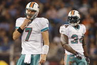 CHARLOTTE - NOVEMBER 19: (L-R) Chad Henne #7 and Ricky Williams #34 of the Miami Dolphins look from the field against the Carolina Panthers at Bank of America Stadium on November 19, 2009 in Charlotte, North Carolina.  (Photo by Streeter Lecka/Getty Images)