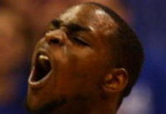LAWRENCE, KS - JANUARY 13:  Sherron Collins #4of the Kansas Jayhawks reacts after scoring against the Kansas State Wildcats during the game on January 13, 2009 at Allen Fieldhouse in Lawrence, Kansas.  (Photo by Jamie Squire/Getty Images)