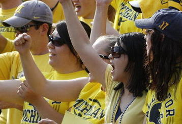 ANN ARBOR, MI - SEPTEMBER 05:  A fan in the student section holds up a sign supporting head coach Rich Rodriguez during a game between the Western Michigan Broncos and the Michigan Wolverines on September 5, 2009 at Michigan Stadium in Ann Arbor, Michigan. Michigan won the game 31-7.  (Photo by Gregory Shamus/Getty Images)