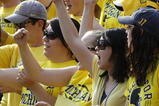 ANN ARBOR, MI - SEPTEMBER 05:  A fan in the student section holds up a sign supporting head coach Rich Rodriguez during a game between the Western Michigan Broncos and the Michigan Wolverines on September 5, 2009 at Michigan Stadium in Ann Arbor, Michigan. Michigan won the game 31-7.  (Photo by Gregory Shamus/Getty Images)