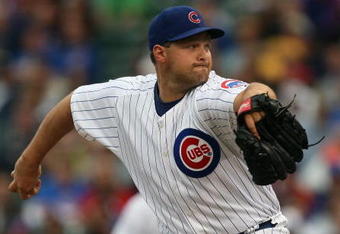 CHICAGO - JULY 8:  Aaron Heilman #47 of the Chicago Cubs pitches against the Atlanta Braves during the game on July 8, 2009 at Wrigley Field in Chicago, Illinois. (Photo by Jonathan Daniel/Getty Images) 