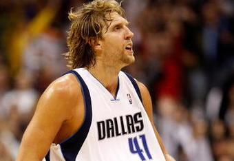 DALLAS - NOVEMBER 18:  Forward Dirk Nowitzki #41 of the Dallas Mavericks reacts after scoring in overtime against the San Antonio Spurs on November 18, 2009 at American Airlines Center in Dallas, Texas.  NOTE TO USER: User expressly acknowledges and agrees that, by downloading and/or using this Photograph, user is consenting to the terms and conditions of the Getty Images License Agreement.  (Photo by Ronald Martinez/Getty Images)