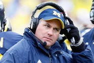ANN ARBOR, MI - OCTOBER 24:  Head coach Rich Rodriguez of the Michigan Wolverines looks on during the game against the Penn State Nittany Lions on October 24, 2009 at Michigan Stadium in Ann Arbor, Michigan. (Photo by  Gregory Shamus/Getty Images)