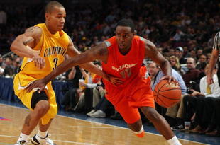 NEW YORK - NOVEMBER 19: Scoop Jardine #11 #11of the Syracuse Orange drives to the basket against Jermone Randle #3 of the California Golden Bears during their semifinal game of the 2K Sports Classic on November 19, 2009 at Madison Square Garden in New York City. (Photo by Jim McIsaac/Getty Images)
