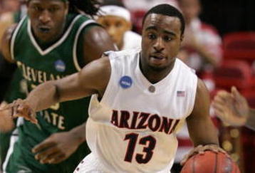 MIAMI - MARCH 22:  Guard Nic Wise #13 of the  University of Arizona Wildcats steals the ball from forward J'Nathan Bullock (L) of the Cleveland State University Vikings during the second round of the NCAA Division I Men's Basketball Tournament at the American Airlines Arena on March 22, 2009 in Miami, Florida.  (Photo by Marc Serota/Getty Images)