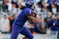 BOISE, ID - NOVEMBER 28: Kyle Wilson #1 of the Boise State Broncos runs against the Fresno State Bulldogs during their game on November 28, 2008 at Bronco Stadium in Boise, Idaho.  (Photo by Otto Kitsinger III/Getty Images)