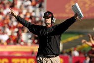 LOS ANGELES, CA - NOVEMBER 14:  Head coach Jim Harbaugh of the Stanford Cardinal signals during the game with the USC Trojans on November 14, 2009 at the Los Angeles Coliseum in Los Angeles, California.  Stanford won 55-21.  (Photo by Stephen Dunn/Getty Images)