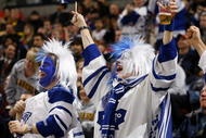 OTTAWA, ON - NOVEMBER 17:  Two lively fans of the Toronto Maple Leafs celebrate a goal against the Ottawa Senators in a game at Scotiabank Place on November 17, 2009 in Ottawa, Canada. (Photo by Phillip MacCallum/Getty Images)