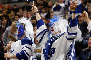 OTTAWA, ON - NOVEMBER 17:  Two lively fans of the Toronto Maple Leafs celebrate a goal against the Ottawa Senators in a game at Scotiabank Place on November 17, 2009 in Ottawa, Canada. (Photo by Phillip MacCallum/Getty Images)