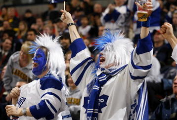 OTTAWA, ON - NOVEMBER 17:  Two lively fans of the Toronto Maple Leafs celebrate a goal against the Ottawa Senators in a game at Scotiabank Place on November 17, 2009 in Ottawa, Canada. (Photo by Phillip MacCallum/Getty Images)