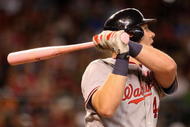 PHOENIX - MAY 10:  Adam Dunn #44 of the Washington Nationals hits a solo home run against the Arizona Diamondbacks during the third inning of the major league baseball game at Chase Field on May 10, 2009 in Phoenix, Arizona.  (Photo by Christian Petersen/Getty Images)