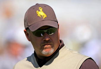 BOULDER, CO - SEPTEMBER 19:  Head coach Dave Christensen of the Wyoming Cowboys prepares to lead his team against the Colorado Buffaloes at Folsom Field on September 19, 2009 in Boulder, Colorado. The Buffaloes defeated the Cowboys 24-0.  (Photo by Doug Pensinger/Getty Images)