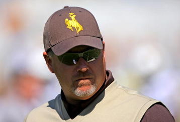 BOULDER, CO - SEPTEMBER 19:  Head coach Dave Christensen of the Wyoming Cowboys prepares to lead his team against the Colorado Buffaloes at Folsom Field on September 19, 2009 in Boulder, Colorado. The Buffaloes defeated the Cowboys 24-0.  (Photo by Doug Pensinger/Getty Images)