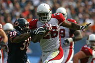 CHICAGO - NOVEMBER 08: Beanie Wells #26 of the Arizona Cardinals breaks away from Danieal Manning #38 of the Chicago Bears at Soldier Field on November 8, 2009 in Chicago, Illinois. The Cardinals defeated the Bears 41-21. (Photo by Jonathan Daniel/Getty Images)