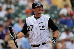 DENVER - MAY 31:  Garrett Atkins #27 of the Colorado Rockies heads to the dugout after striking out against the San Diego Padres during MLB action at Coors Field on May 31, 2009 in Denver, Colorado. The Padres defeated the Rockies 5-2.  (Photo by Doug Pensinger/Getty Images)