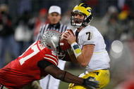 COLUMBUS, OH - NOVEMBER 18:  David Patterson #97 of the Ohio State Buckeyes hits quarterback Chad Henne #7 of the Michigan Wolverines November 18, 2006 at Ohio Stadium in Columbus, Ohio. Ohio State won 42-39.  (Photo by Gregory Shamus/Getty Images)