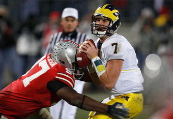 COLUMBUS, OH - NOVEMBER 18:  David Patterson #97 of the Ohio State Buckeyes hits quarterback Chad Henne #7 of the Michigan Wolverines November 18, 2006 at Ohio Stadium in Columbus, Ohio. Ohio State won 42-39.  (Photo by Gregory Shamus/Getty Images)