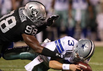 OAKLAND, CA - AUGUST 13: Defensive end Jay Richardson #98 of the Oakland Raiders sacks quarterback Jon Kitna #3 of the Dallas Cowboys after a bad snap during the preseason game at Oakland-Alameda County Coliseum on August 13, 2009 in Oakland, California. (Photo by Jed Jacobsohn/Getty Images)