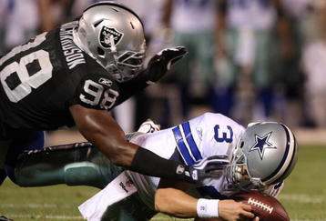 OAKLAND, CA - AUGUST 13: Defensive end Jay Richardson #98 of the Oakland Raiders sacks quarterback Jon Kitna #3 of the Dallas Cowboys after a bad snap during the preseason game at Oakland-Alameda County Coliseum on August 13, 2009 in Oakland, California. (Photo by Jed Jacobsohn/Getty Images)