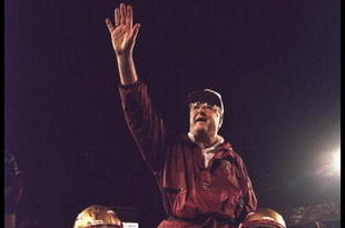 1 Jan 1996:  Head coach Bobby Bowden of the Florida State Seminoles is carried triumphantly off the field by nose guard Andre Wadsworth #8 and tackle Orpheus Roy after defeating the Notre Dame Fighting Irish in the Orange Bowl in Miami, Florida 31-26.  Ma