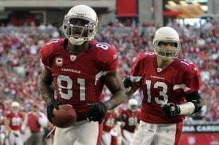 GLENDALE, AZ - DECEMBER 23: Anquan Boldin #81 of the Arizona Cardinals celebrates his second touchdown of the game in front of Kurt Warner #13 for a 14-7 lead against the Atlanta Falcons during the second quarter at University of Phoenix Stadium on December 23, 2007 in Glendale, Arizona. (Photo by Harry How/Getty Images)