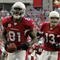 GLENDALE, AZ - DECEMBER 23:  Anquan Boldin #81 of the Arizona Cardinals celebrates his second touchdown of the game in front of Kurt Warner #13 for a 14-7 lead against the Atlanta Falcons during the second quarter at University of Phoenix Stadium on December 23, 2007 in Glendale, Arizona.  (Photo by Harry How/Getty Images)