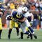 ANN ARBOR, MI - OCTOBER 24:  Josh Hull #43 of the Penn State Nittany Lions tackles Brandon Minor #4 of the Michigan Wolverines on October 24, 2009 at Michigan Stadium in Ann Arbor, Michigan. (Photo by  Gregory Shamus/Getty Images)