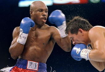 17 Sep 1994:  Julio Cesar Chavez tries to dodge a punch from Meldrick Taylor during a fight.  Chavez won the fight with an eighth round technical knockout. Mandatory Credit: Al Bello  /Allsport